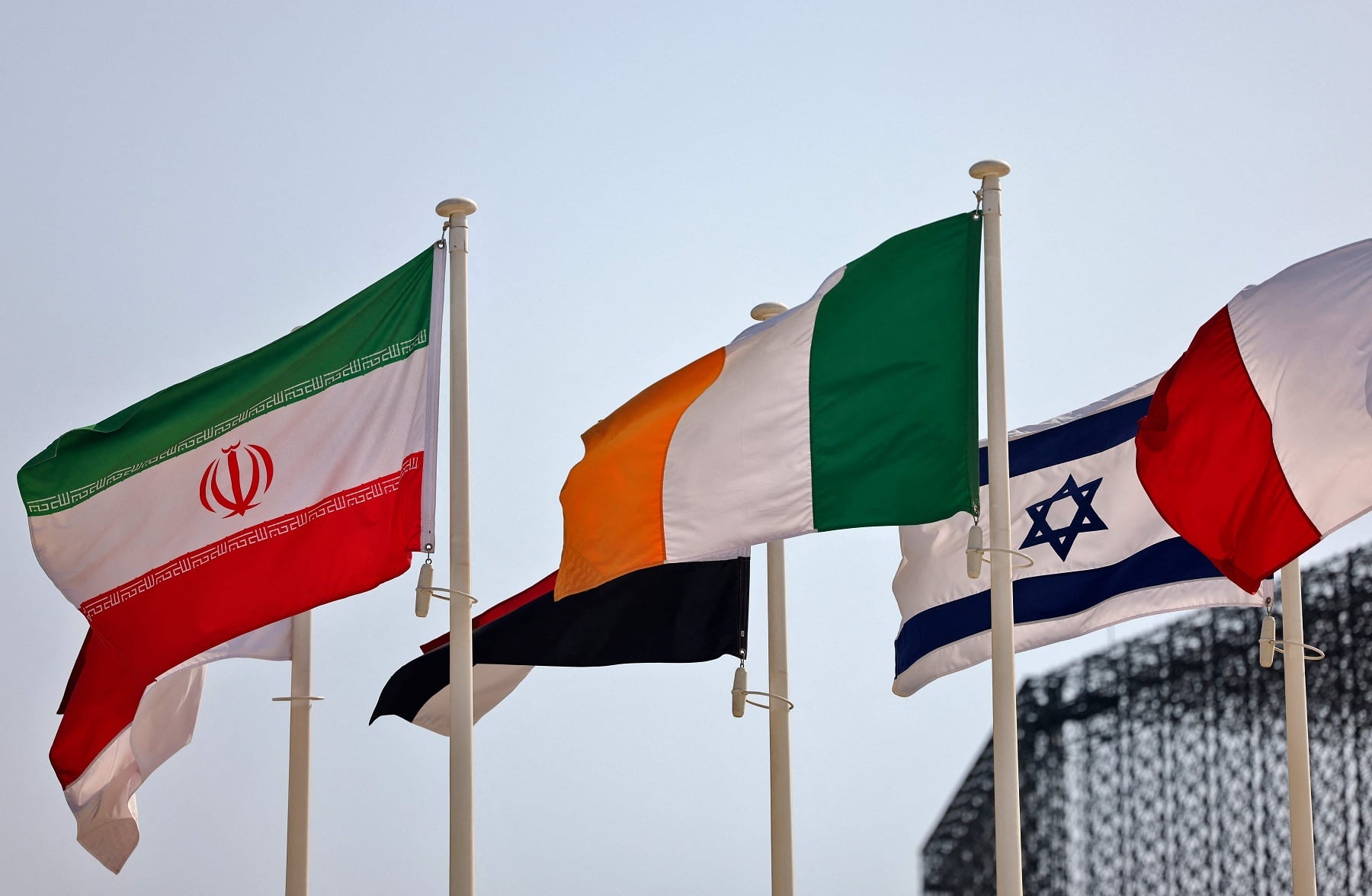 Iranian and Israeli flags are pictured near each other at the Dubai Expo 2020. — AFP