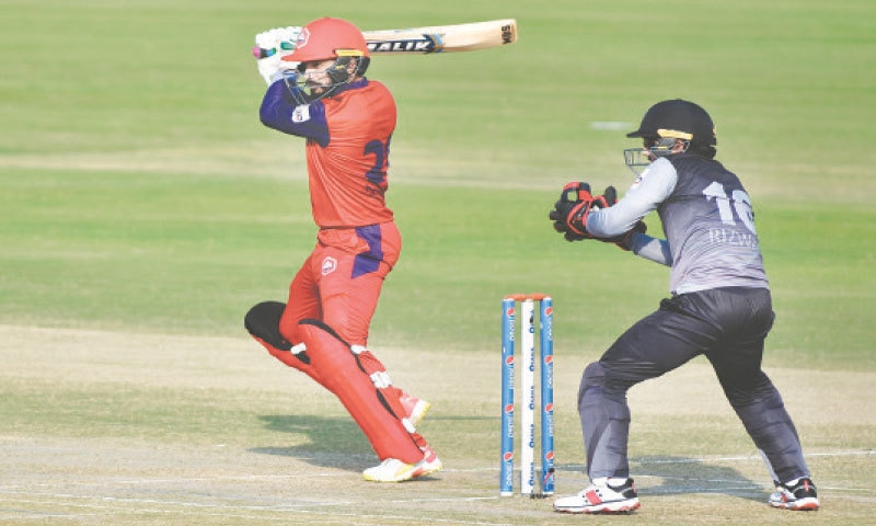 RAWALPINDI: Northern all-rounder Mohammad Nawaz cuts on his way to 51 as Khyber Pakhtunkhwa captain Mohammad Rizwan looks on during their National T20 Cup match at the Pindi Cricket Stadium on Sunday. — Tanveer Shahzad / White Star