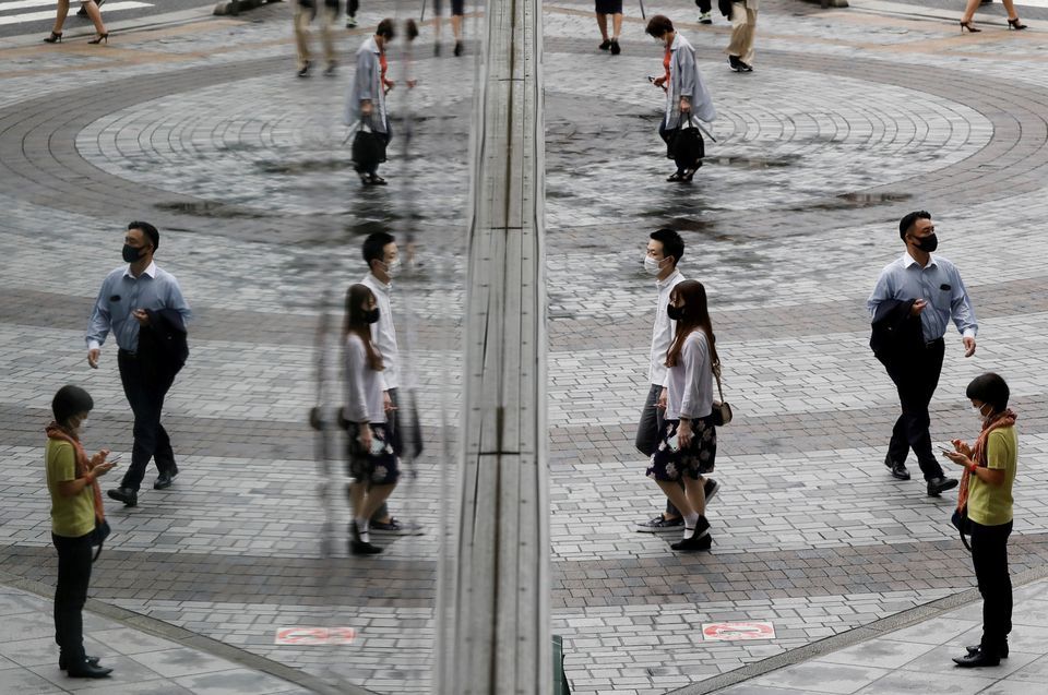 People wearing protective masks amid the coronavirus outbreak make their way at a shopping district in Tokyo, Japan, September 9. — Reuters