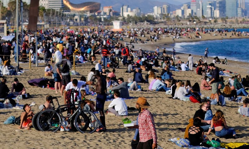 This file photo shows people spending time at Barceloneta beach, amid the Covid-19 outbreak in Barcelona, Spain. — Reuters/File