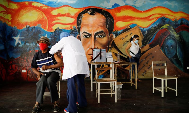 In this file photo, a man receives a dose of the Sinopharm vaccine, with healthcare workers going from door to door to inoculate the elderly and people with disabilities in Caracas, Venezuela. &mdash; Reuters/File