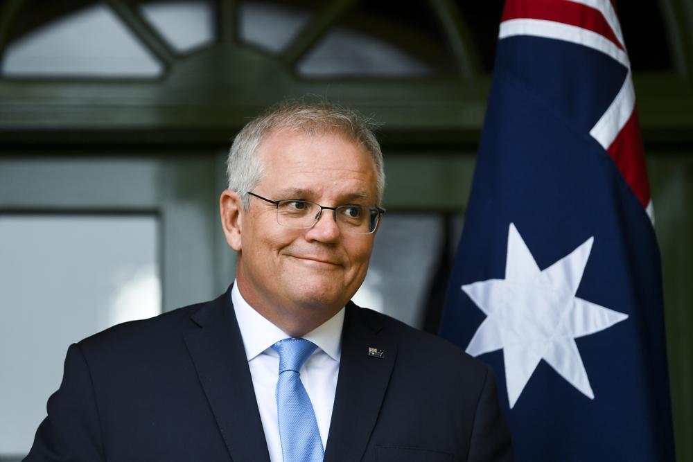 Australian Prime Minister Scott Morrison discusses travel restrictions during a press conference in Canberra, Australia, Oct 1. — AP