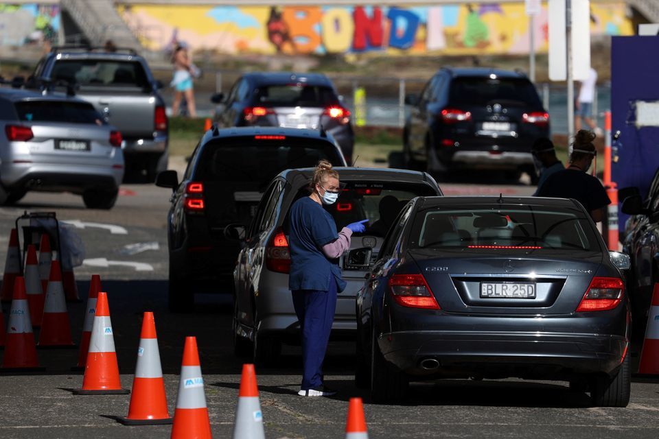 A health worker speaks with a person inside a vehicle at the Bondi Beach drive-through coronavirus testing centre during a lockdown in Sydney, Australia, October 5. — Reuters