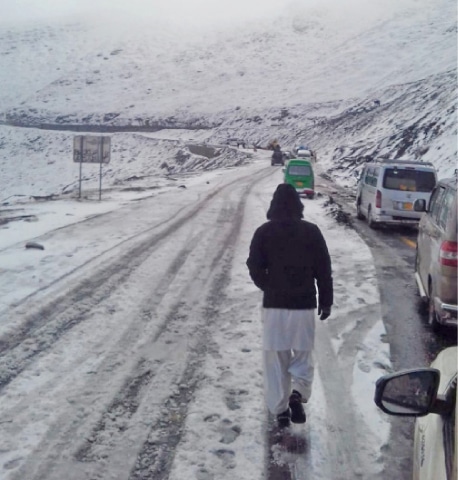 Traffic resumes on MNJ Road on Monday after clearance of snow. &mdash; Dawn
