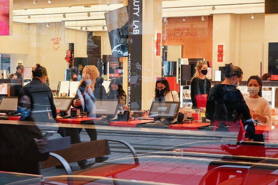 Shoppers wear protective face masks inside a store as businesses re-open to vaccinated patrons in the wake of coronavirus regulations easing, following months of lockdown orders to curb the rise in the number of cases, in Sydney, Australia, October 12. — Reuters