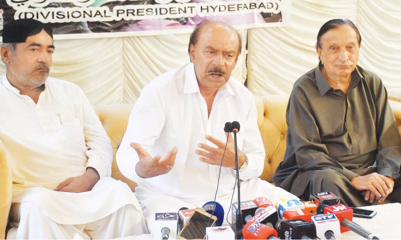 Nisar Ahmed Khuhro (centre) gestures during the press conference as others look on.—Online