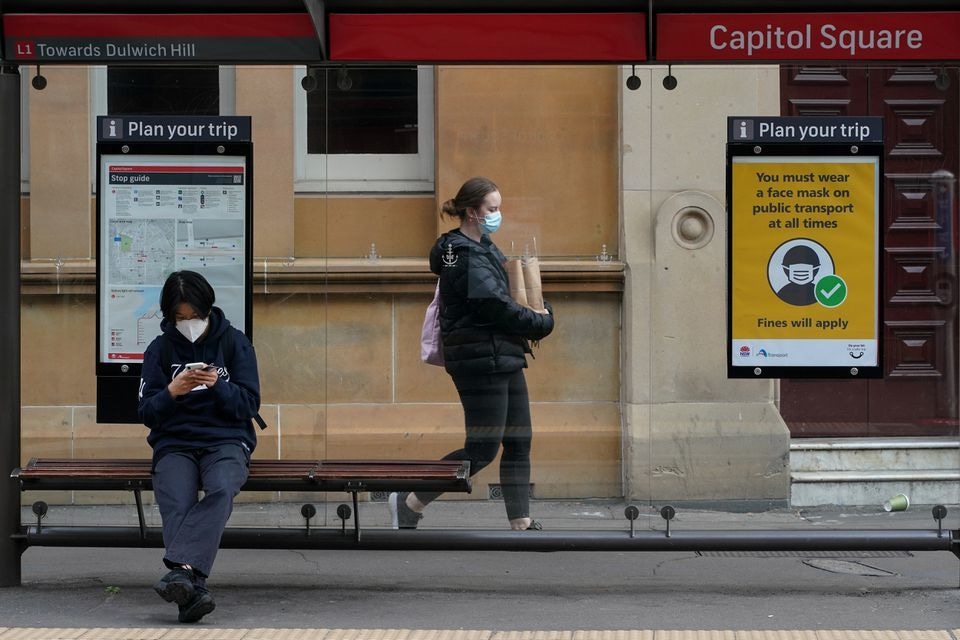 People wear protective face masks in the city centre during a lockdown to curb the spread of Covid-19 in Sydney on September 28. — Reuters