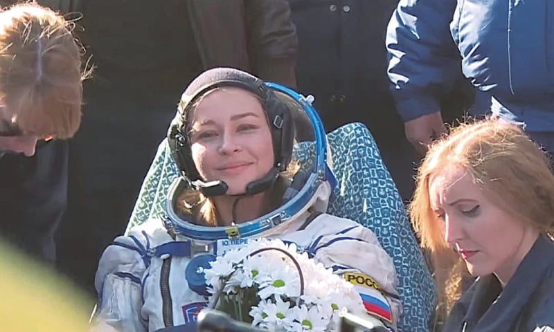 KHEZKAZGAN (Kazakhstan): Russian actress Yulia Peresild, an International Space Station crew member, rests after the landing of Soyuz space capsule in a remote area on Sunday in this still image taken from video.&mdash;Reuters