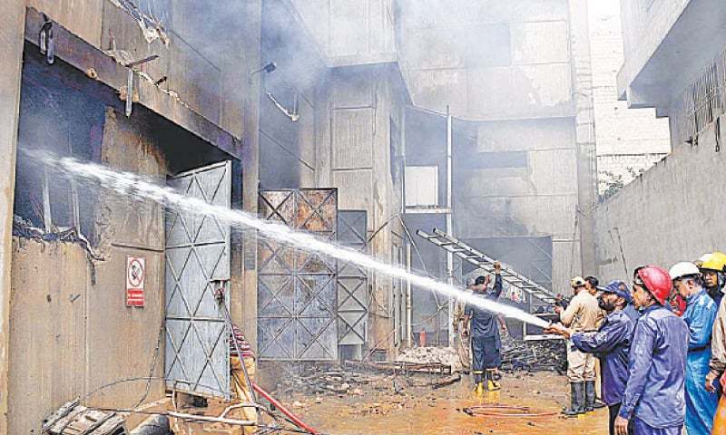 A team of firefighters extinguish the fire at the chemical factory. — APP/File