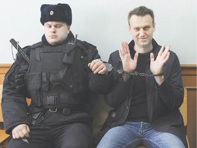 A MARCH 30, 2017, file photo shows Russian opposition leader Alexei Navalny (right) posing for the press in a  Moscow court.—AP