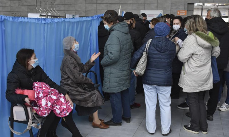 This photo shows people waiting for their turn at a vaccination centre in Kramatorsk, Ukraine. &mdash; AP