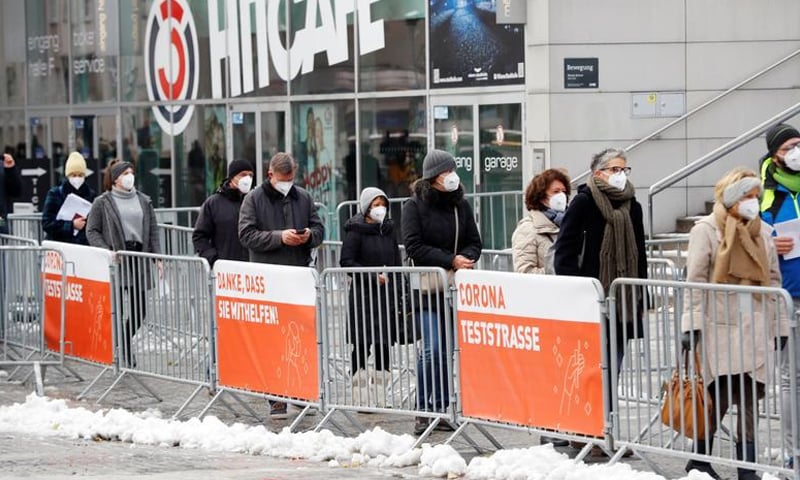 In this file photo, people queue before a Covid testing facility in Vienna, Austria. — Reuters/File