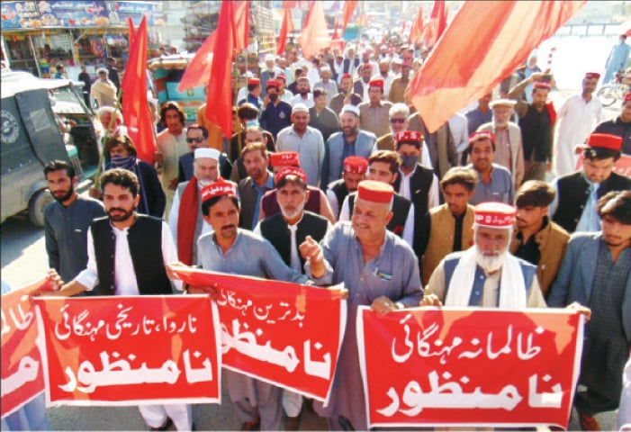 ANP protesters pass through Batkhela Bazaar on Monday. — Dawn