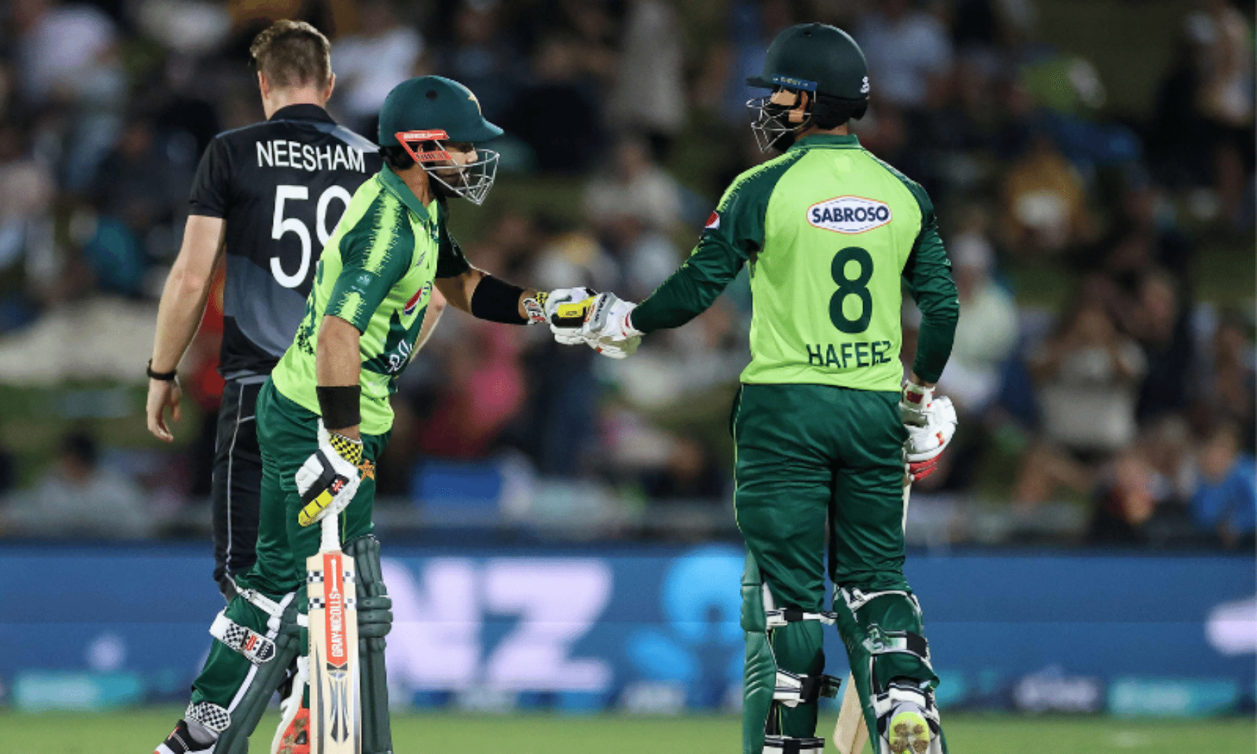 Pakistan's Mohammad Rizwan (L) celebrates hitting a six with a teammate Mohammad Hafeez during the third T20 cricket match between New Zealand and Pakistan at McLean Park on Dec 22, 2020. — AFP/File