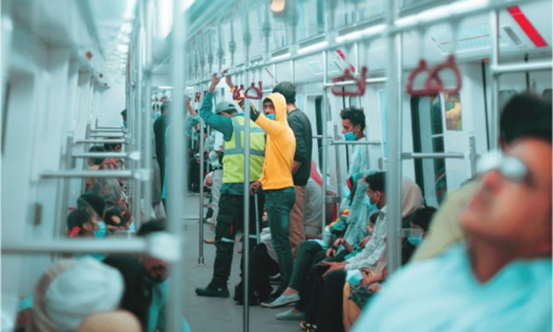 Passengers ride the Orange Line Metro Train. — Photo by Zaroon Ahmad Khan and Abdullah Bajwa/File