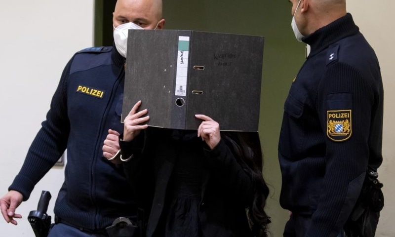Defendant Jennifer W arrives in a courtroom for her trial in Munich, Germany, Oct 25. &mdash; AP