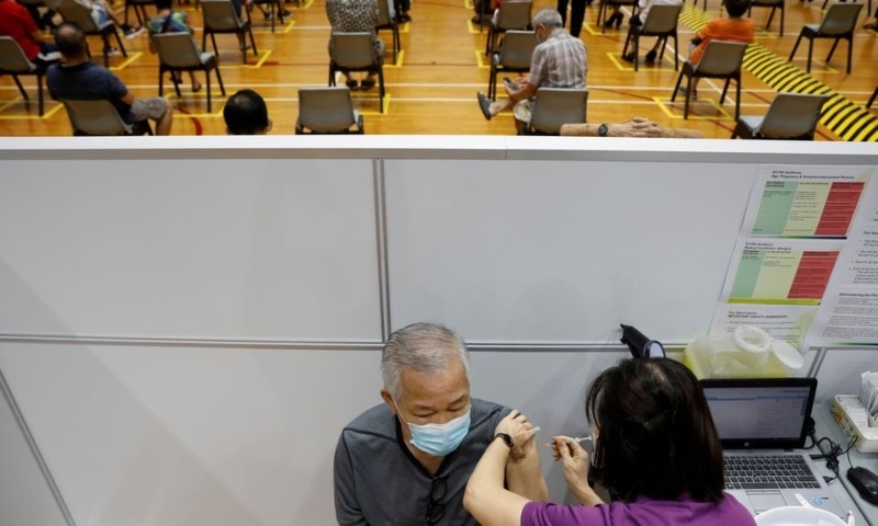 A man receives his vaccination at a coronavirus vaccination centre in Singapore. — Reuters/File
