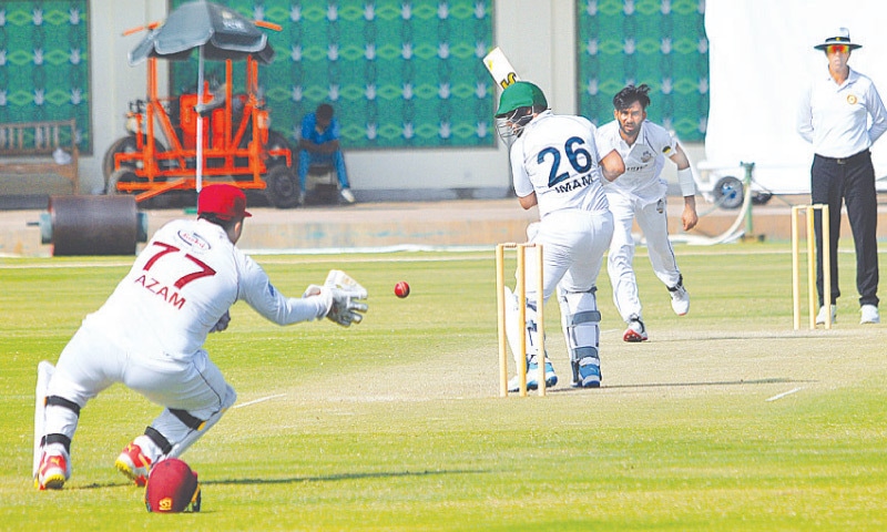 MULTAN: Southern Punjab wicket-keeper Azam Khan attempts to stop the ball after Balochistan opener Imam-ul-Haq plays and misses during their Quaid-e-Azam Trophy match at the Multan Cricket Stadium on Thursday. — APP