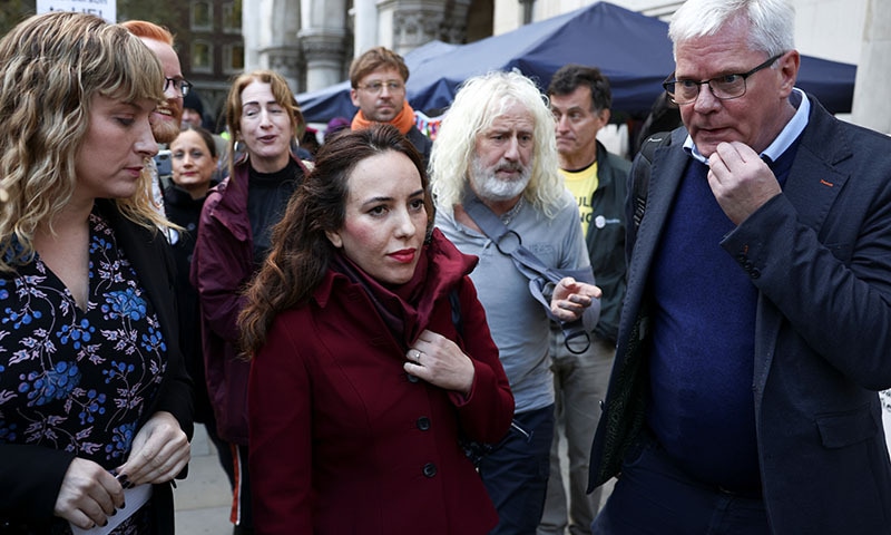 Stella Morris, partner of Wikileaks founder Julian Assange, looks on next to Editor in Chief of Wikileaks Kristinn Hrafnsson as supporters of Wikileaks founder Julian Assange protest outside the Royal Courts of Justice in London, Britain, on Thursday. — Reuters