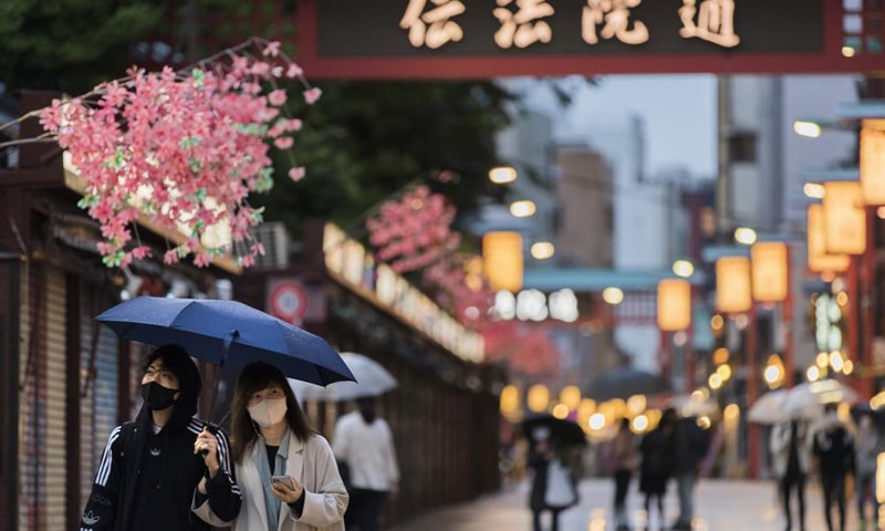 In this April 29, 2021 file photo, people walk through a shopping street along the famed Sensoji temple in the Asakusa neighbourhood in Tokyo, Japan. — AP/File