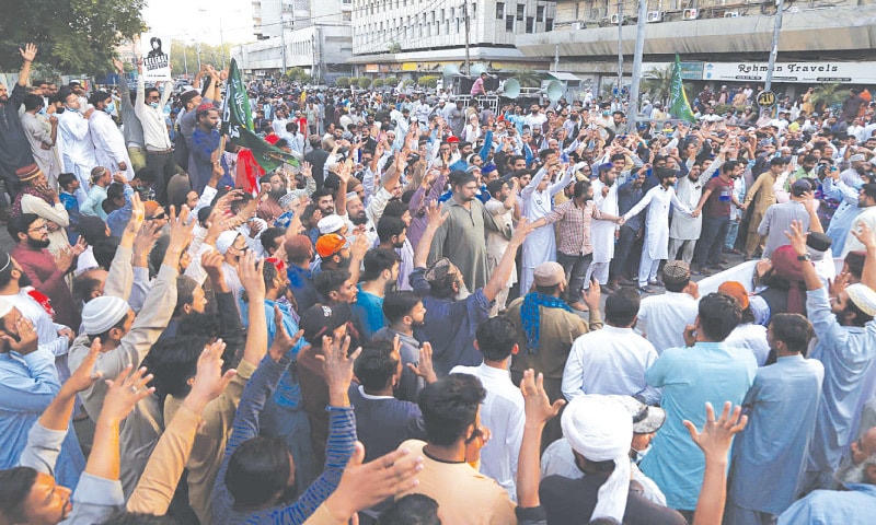 Activists of the banned Tehreek Labbaik Pakistan take part in a demonstration outside Karachi Press Club on Friday.— PPI Activists of the banned Tehreek Labbaik Pakistan take part in a demonstration outside Karachi Press Club on Friday.— PPI