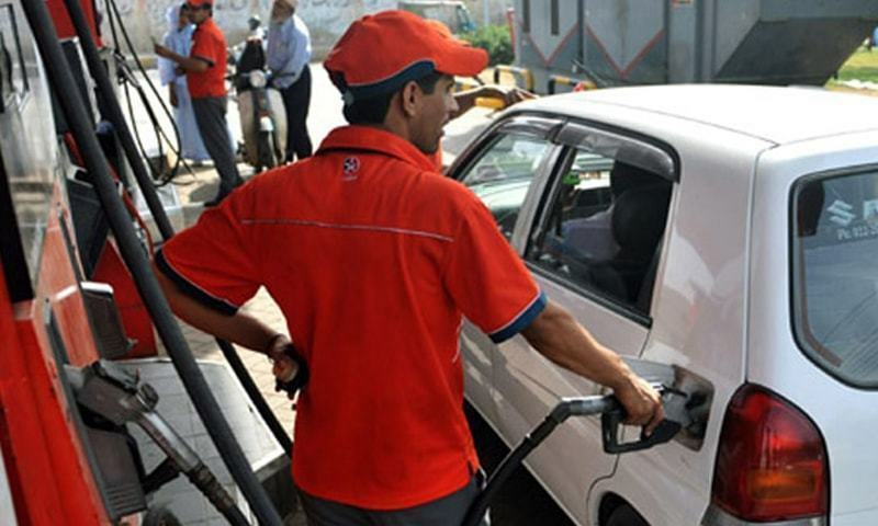 A man refuels a car in this file photo. — AFP/File