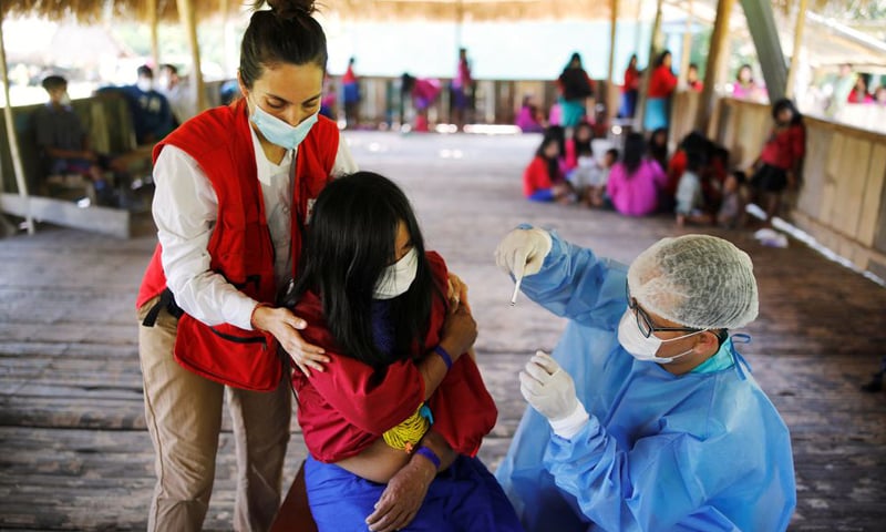 In this October 11, 2021 file photo, a woman is administered a vaccine for Covid-19 in Mangual, Peru. — Reuters/File
