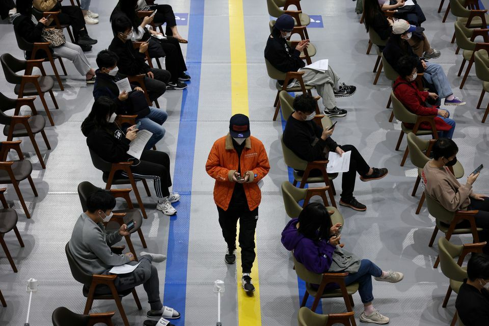 A man who got a dose of the Pfizer-BioNTech coronavirus vaccine leaves a Covid-19 vaccination centre in Seoul, South Korea, October 29. &mdash; Reuters