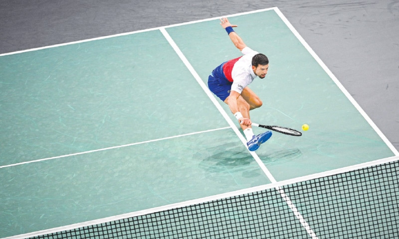 PARIS: Serbia’s Novak Djokovic hits a return to Taylor Fritz of the US during their Paris Masters quarter-final at the AccorHotels Arena.—AFP PARIS: Serbia’s Novak Djokovic hits a return to Taylor Fritz of the US during their Paris Masters quarter-final at the AccorHotels Arena.—AFP