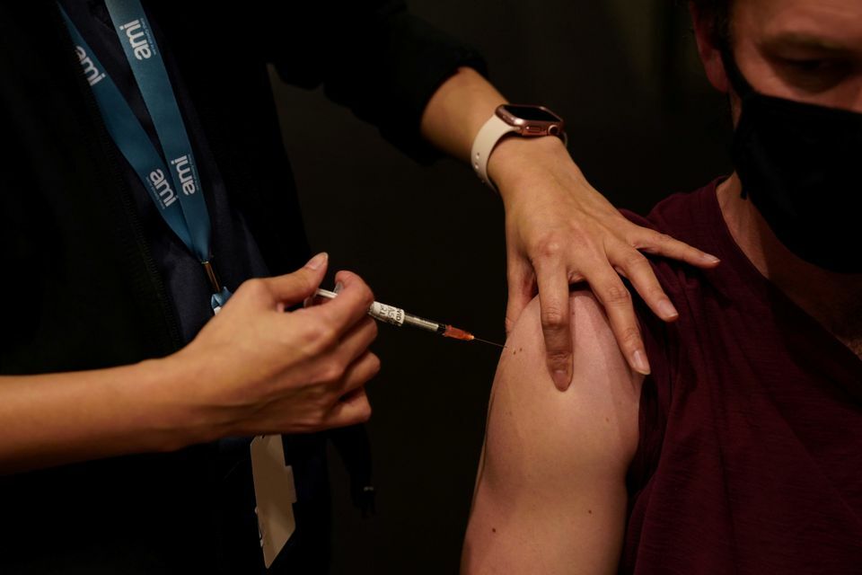 A nurse administers the AstraZeneca vaccine to a patient at a coronavirus vaccination clinic at the Bankstown Sports Club in Sydney, Australia, August 25. — Reuters
