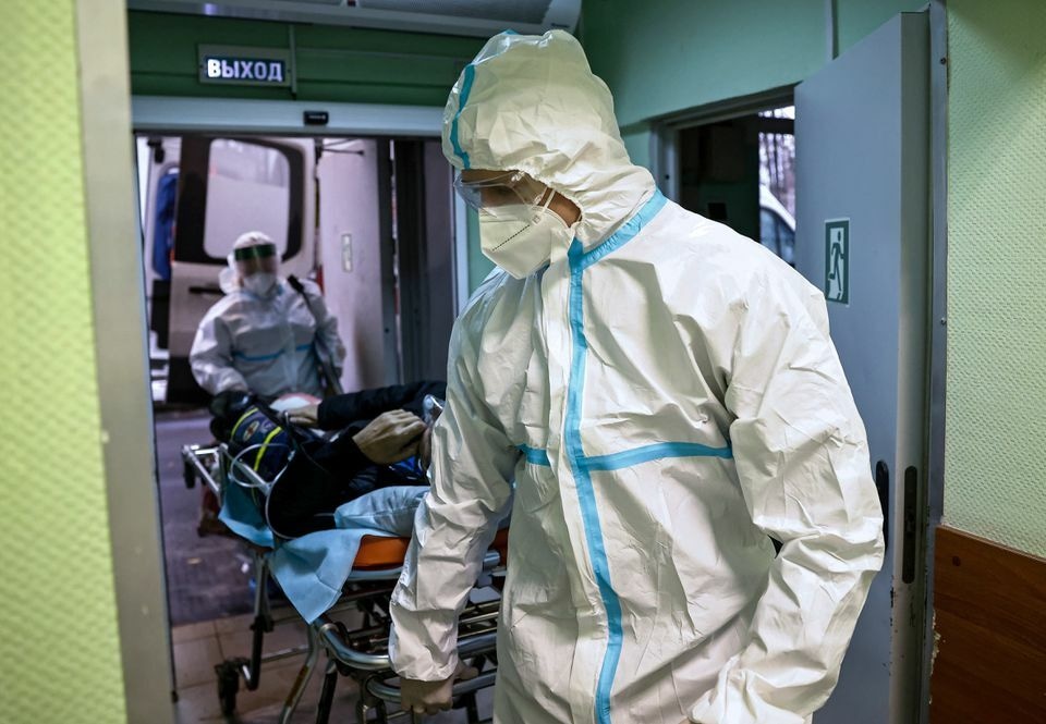 In this file photo, medical specialists transport a patient at the City Clinical Hospital Number 52, where people suffering from Covid-19 are treated, in Moscow, Russia. &mdash; Reuters/File