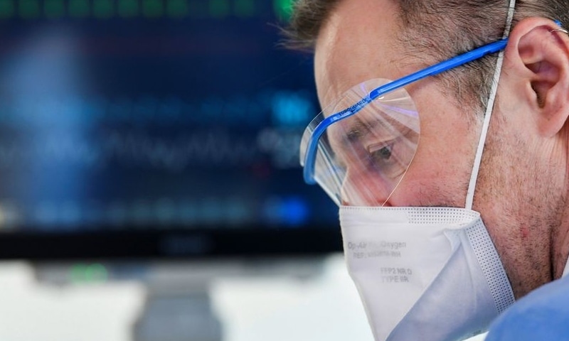 A member of the medical personnel wearing a full protective suit works in the intensive care unit at Maastricht UMC+ Hospital, where patients suffering from the coronavirus are treated, in Maastricht, Netherlands on November 10. — Reuters