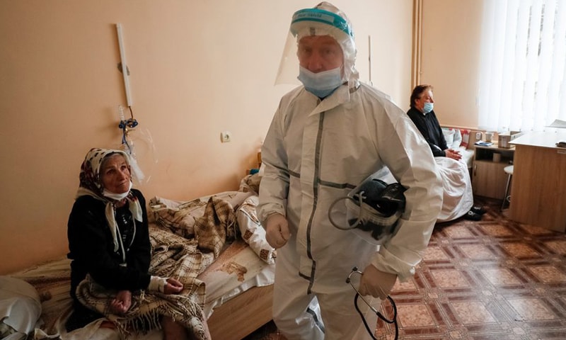 A medical specialist takes care of patients suffering from Covid-19 at a hospital in the town of Ovruch in Zhytomyr region, Ukraine. — Reuters