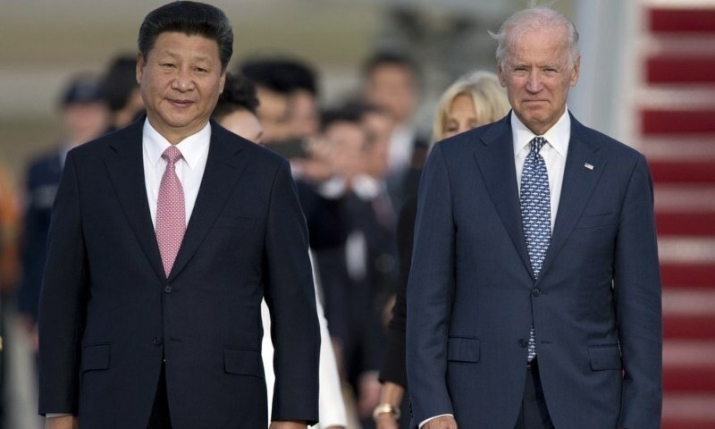 In this Sept 24, 2015, file photo, Chinese President Xi Jinping and then-US vice president Joe Biden walk down the red carpet on the tarmac during an arrival ceremony at Andrews Air Force Base. &mdash; AP