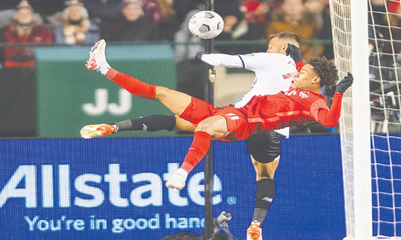 EDMONTON: Canada&rsquo;s Tajon Buchannan attempts a scissors kick during the 2022 World Cup qualifier against Costa Rica.&mdash;AP