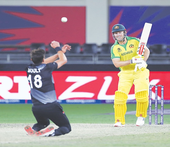 AUSTRALIA&rsquo;S match-winner Mitchell Marsh looks on as New Zealand pacer Trent Boult makes an unsuccessful attempt to take a catch off his shot during the final at the Dubai International Cricket Stadium on Sunday. &mdash;AP