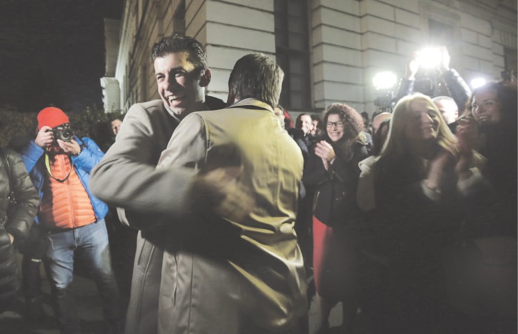KIRIL Petkov (left) and Asen Vasilev, co-leaders of the We Continue the Change party, celebrate their victory in Sofia.&mdash;AP