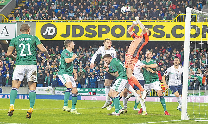 BELFAST: Northern Ireland goalkeeper Bailey Peacock-Farrell jumps to clear the ball during the World Cup 2022 group ‘C’ qualifier against Italy at the Windsor Park stadium.—AP BELFAST: Northern Ireland goalkeeper Bailey Peacock-Farrell jumps to clear the ball during the World Cup 2022 group ‘C’ qualifier against Italy at the Windsor Park stadium.—AP