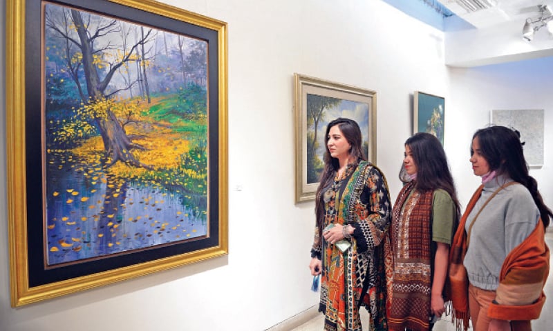 LAHORE: Visitors take interest in an exhibition at Alhamra. &mdash; White Star