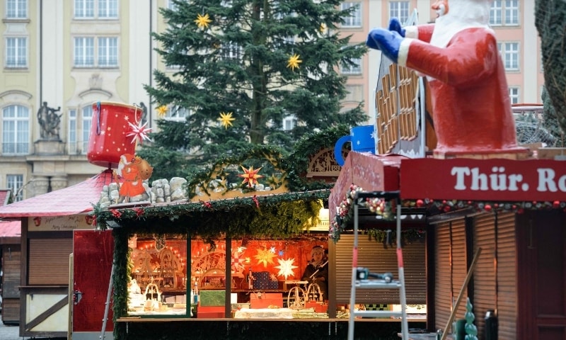 Two still closed booths are pictured during the set-up at the Dresdner Striezelmarkt Christmas market in Dresden, eastern Germany on November 15. — AFP