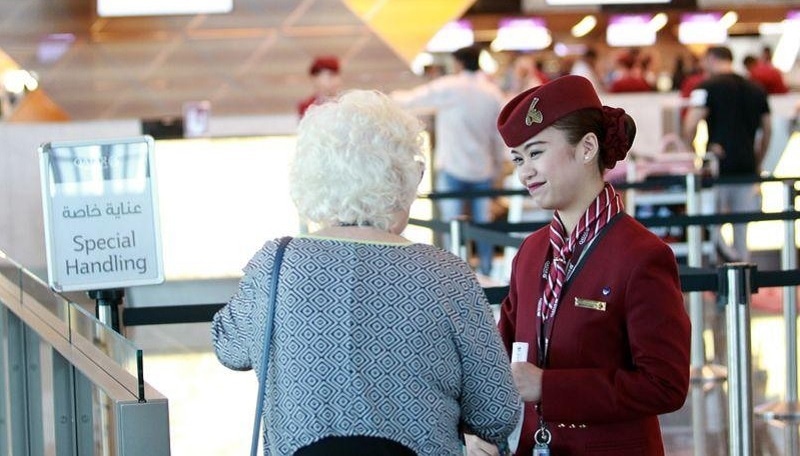 A staff member speaks with a passenger at Hamad International Airport in Doha, Qatar on June 12, 2017. &mdash; Reuters