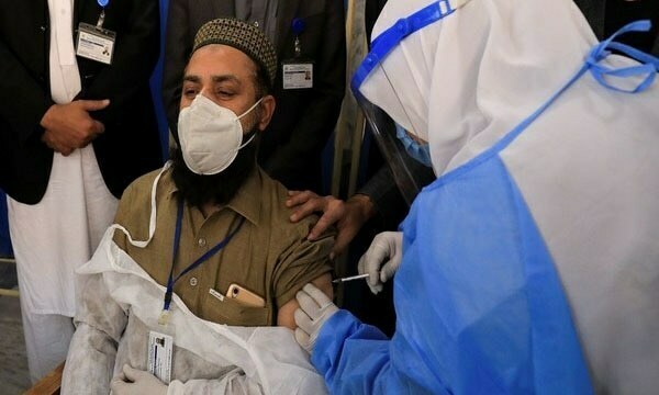 A health worker receives a dose of Sinopharm's coronavirus vaccine at a vaccination centre in Peshawar. — Reuters/File