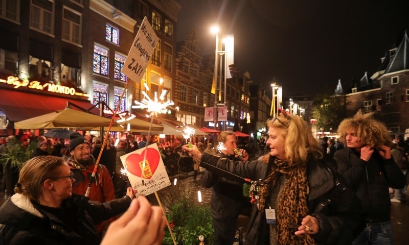 Protestors gather at Cafe del Mondo during demonstrations against coronavirus measures in Amsterdam on November 20. &mdash; AFP