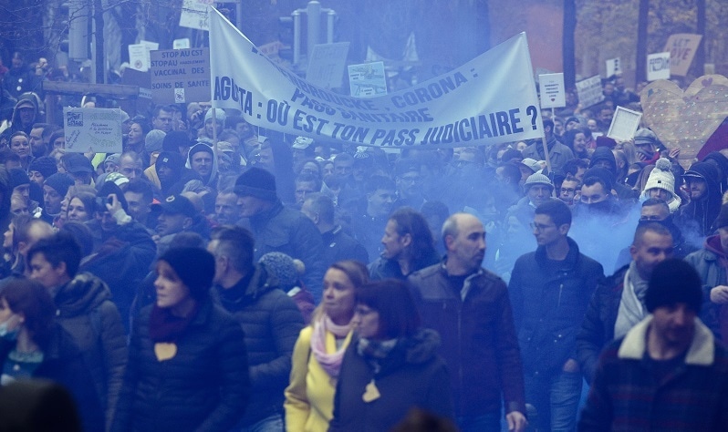 Protesters attend a demonstration against the reinforced measures of the Belgium government to counter the latest spike of the coronavirus in Brussels, Belgium on Sunday. — AP
