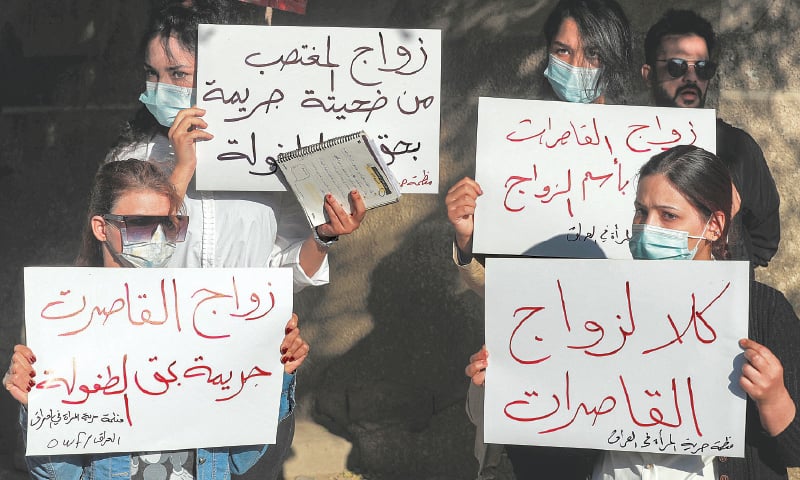 WOMEN demonstrate near a court in protest against the marriage.—AFP WOMEN demonstrate near a court in protest against the marriage.—AFP