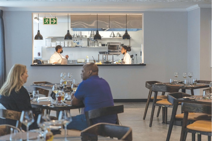 CLIENTS enjoy lunch at the Sanctuary Mandela hotel.—AFP