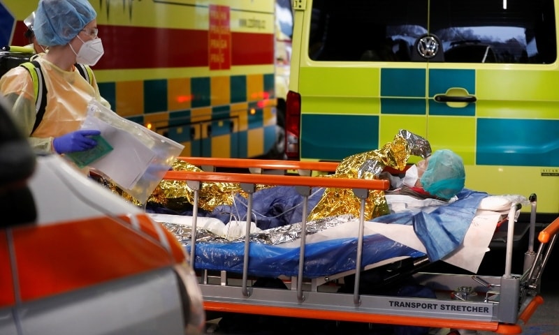 Medical staff members transport a coronavirus patient in Prague, Czech Republic on November 25. &mdash; Reuters