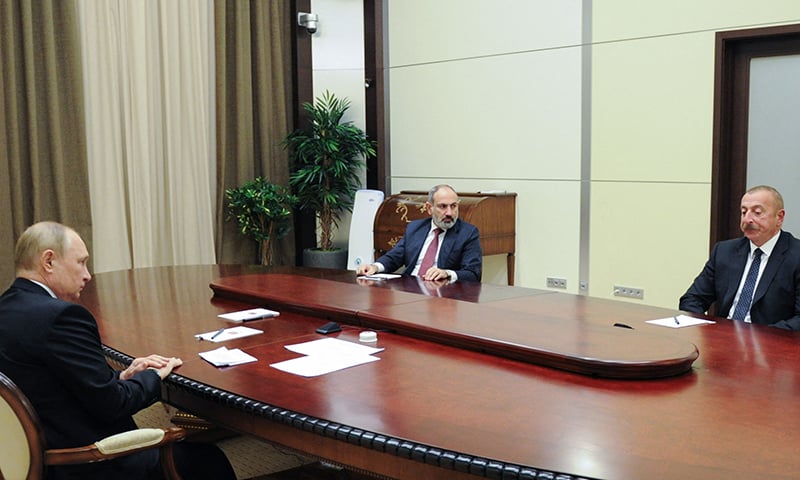 RUSSIAN President Vladimir Putin speaks to Armenian Prime Minister Nikol Pashinyan and Azerbaijani President Ilham Aliyev during the meeting in Sochi. — AFP