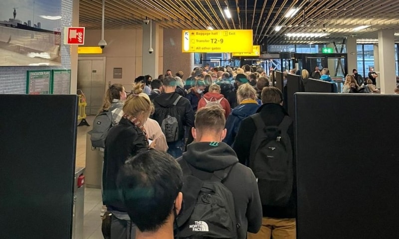 Passengers travelling from South Africa queue to be coronavirus tested after being held on the tarmac at Schiphol Airport, Netherlands, November 26. — Reuters