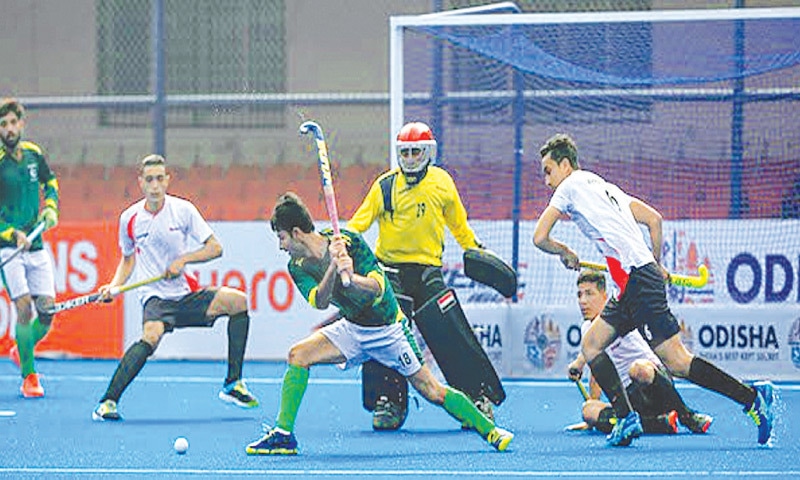 BHUBANESWAR: Players of Pakistan and Egypt vie for the ball during their match of the FIH Junior World Cup at the Kalinga Stadium on Saturday.—FIH